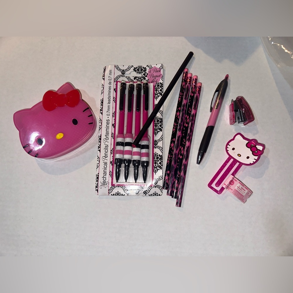 Hello kitty vase and large paper clip and pink themed office supplies